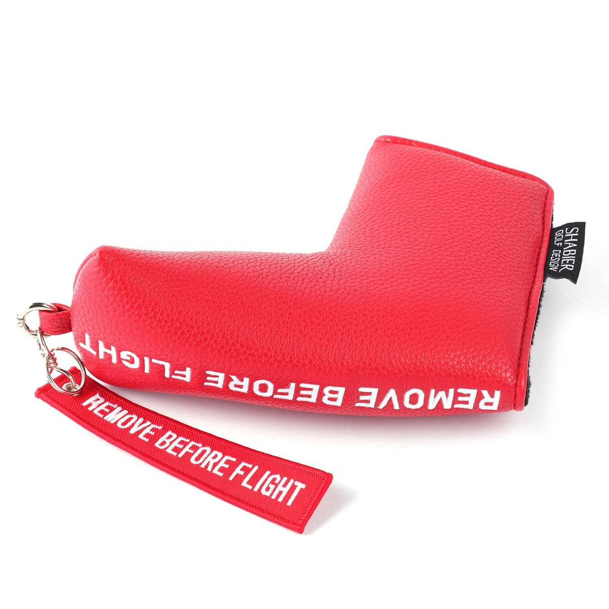 Red blade golf putter cover with "Remove Before Flight" tag and keychain