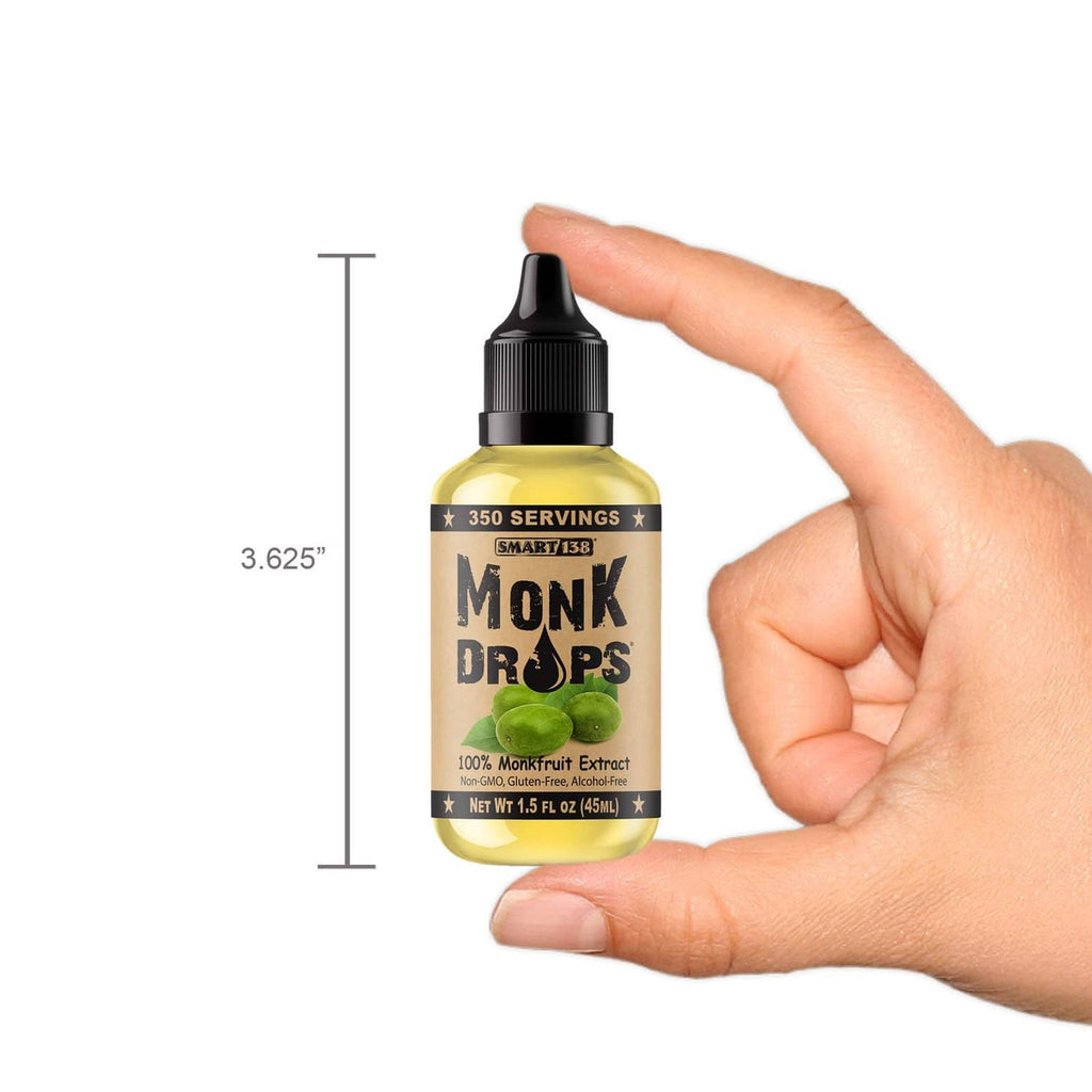 Liquid monkfruit sweetener bottle held by hand, size guide, black dropper cap