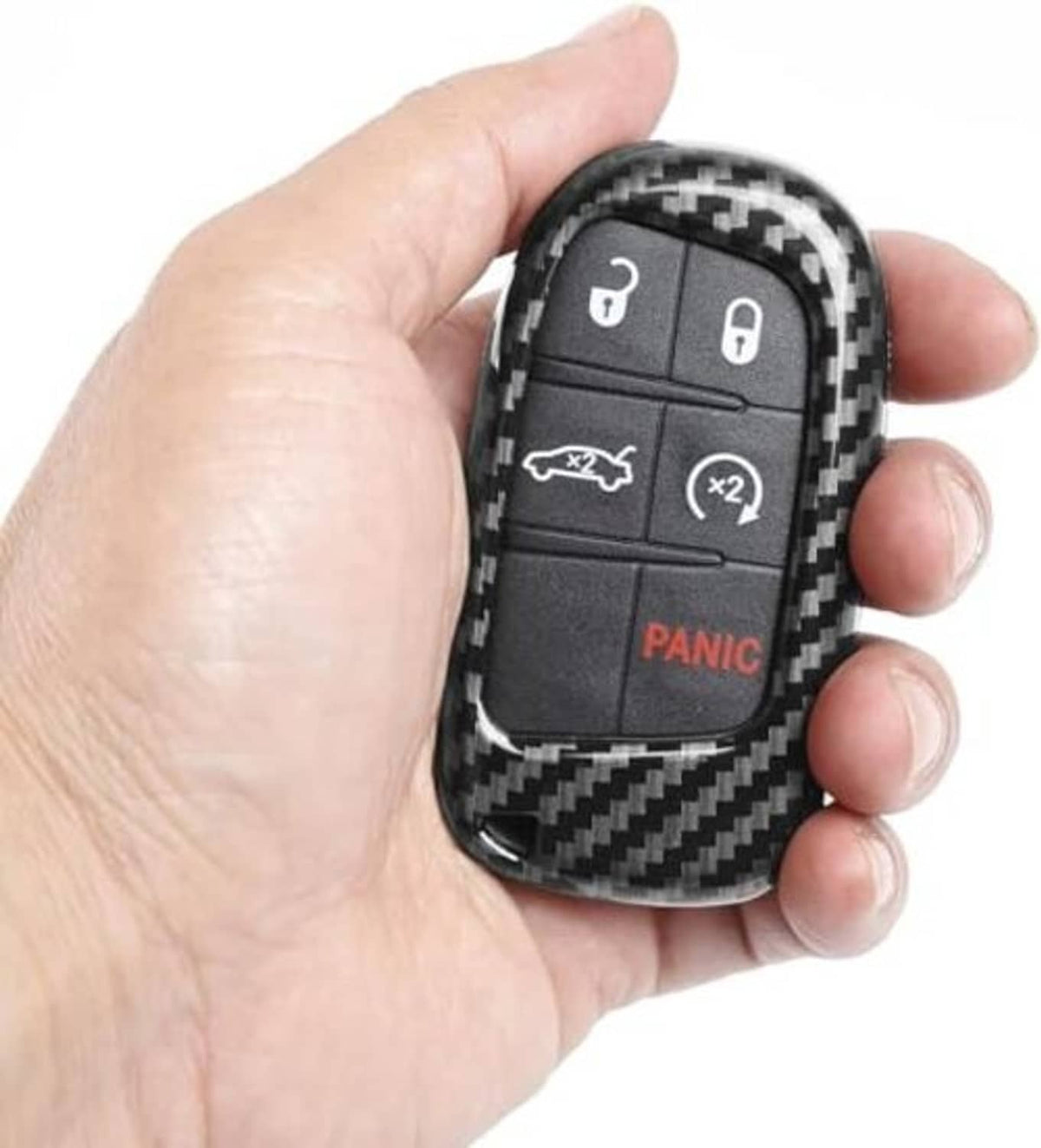 Glossy black carbon fiber key fob shell held in hand, showing lock and Panic
