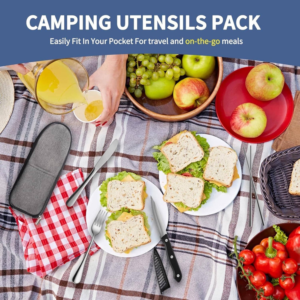Gray zip travel utensil case with stainless fork, knife, and spoon on a picnic setting.