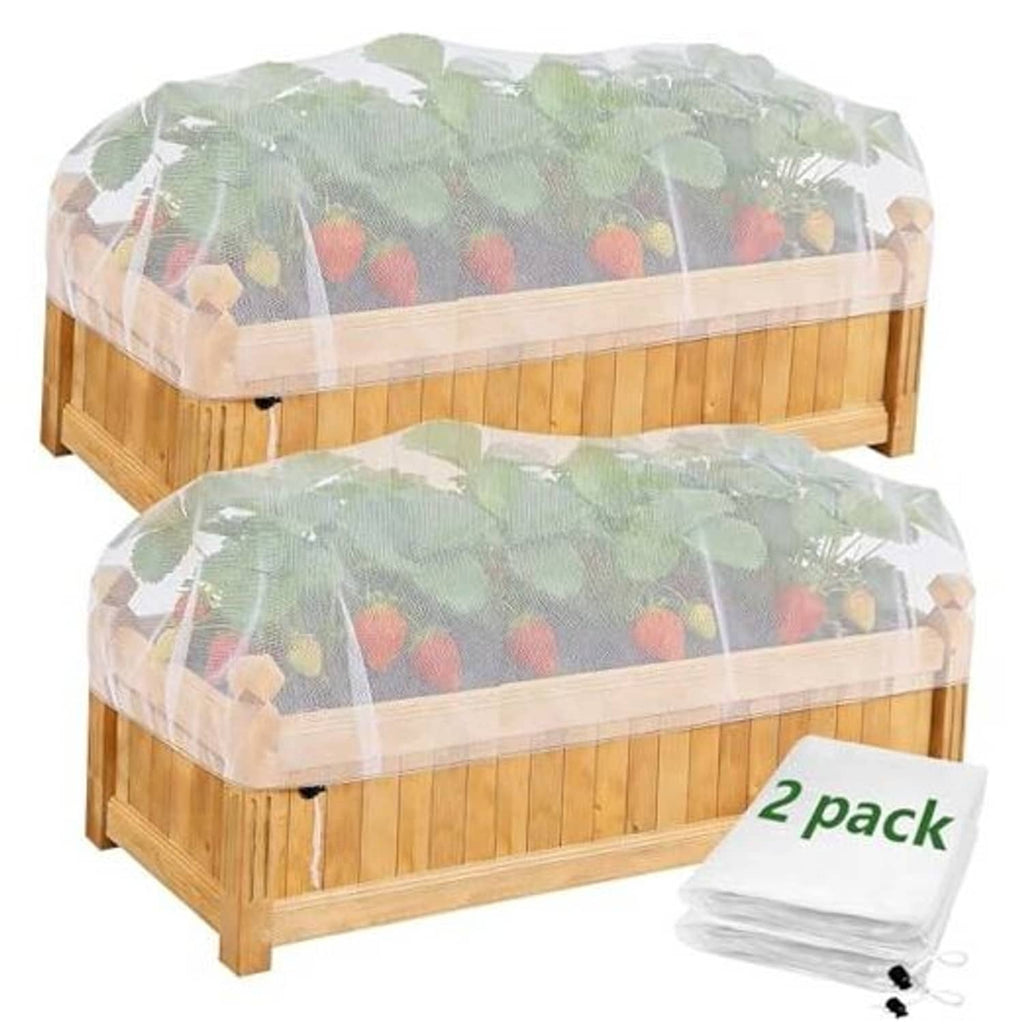 Wood raised bed covered with translucent green garden netting, protecting plants