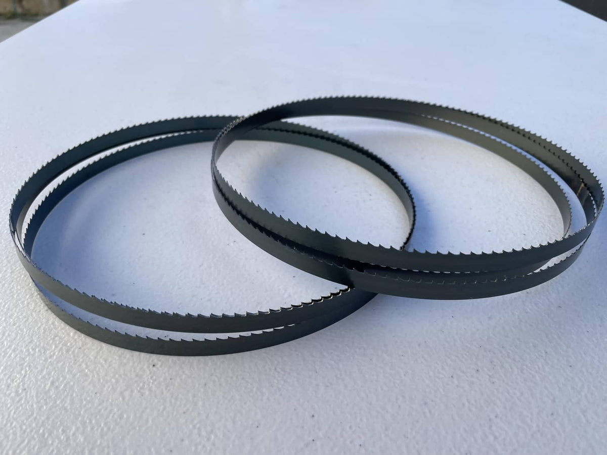 Wood bandsaw blade 2-pack, overlapping dark blue coiled loops on surface