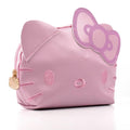 Pink Hello Kitty face mini pouch with cat-ear flap and gold zipper pull