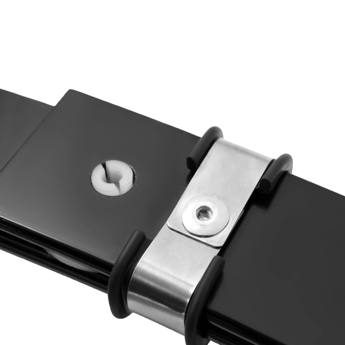 Close-up of front leaf spring clamp with silver bracket and black rubber bushing