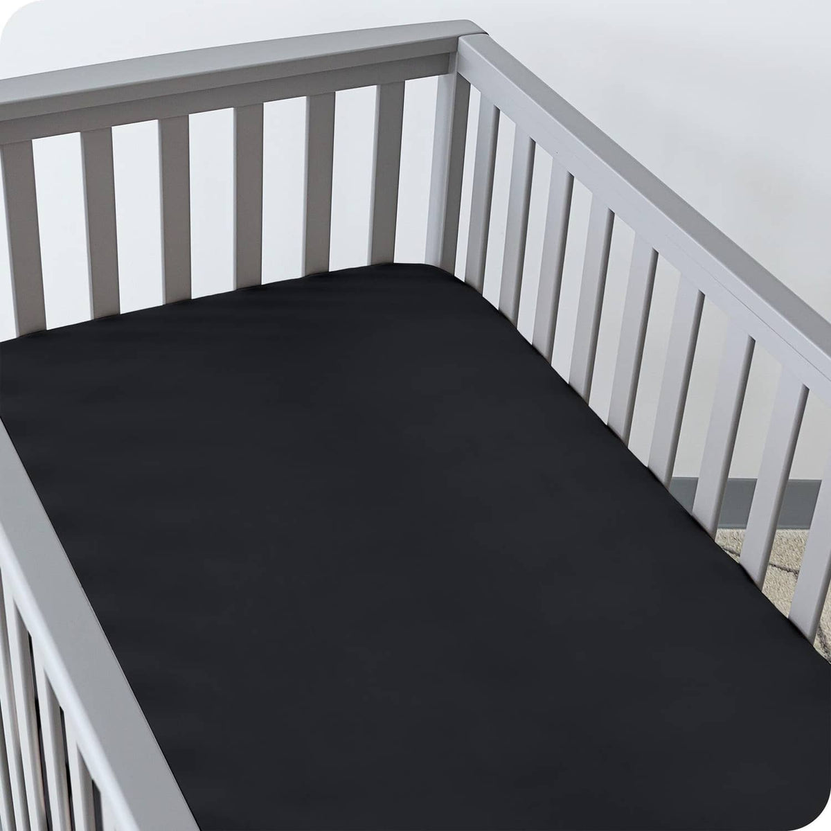 Crib fitted sheet, dark charcoal microfiber with smooth fitted surface on mattress