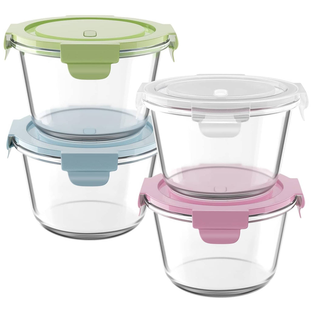 Clear glass meal prep containers with airtight lids in green, blue, and pink.