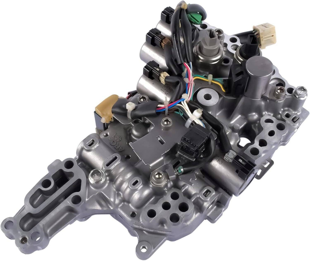 CVT transmission valve body with multi-color wiring and black sensor connectors on silver