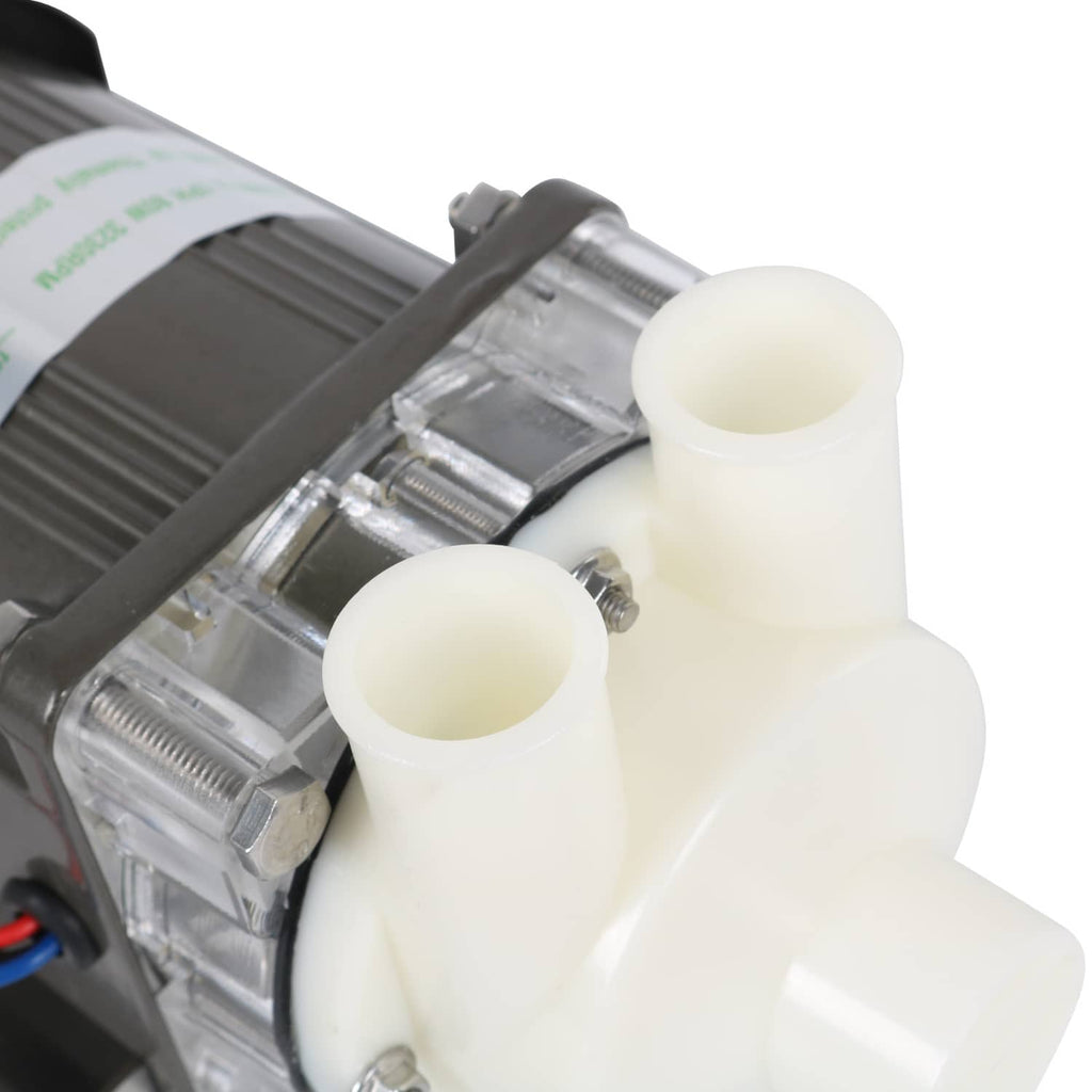 Ice machine water pump motor assembly close-up of white plastic ports and metal shaft