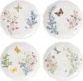 Set of 4 white dinner plates with butterfly and wildflower herb meadow illustrations.