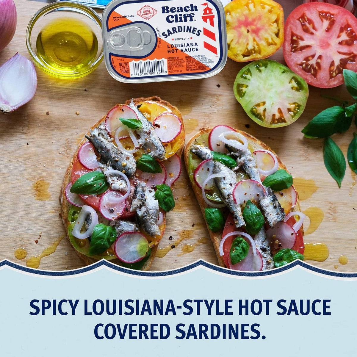 Spicy Louisiana-style hot sauce sardines served with greens and sliced radish