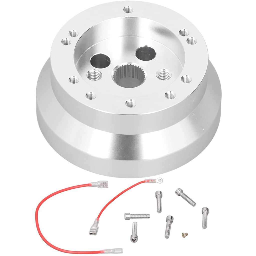 Polished steering wheel hub adapter top view with multiple bolt holes and center cutout