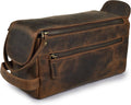 Brown leather travel toiletry bag with top zip and side carry strap