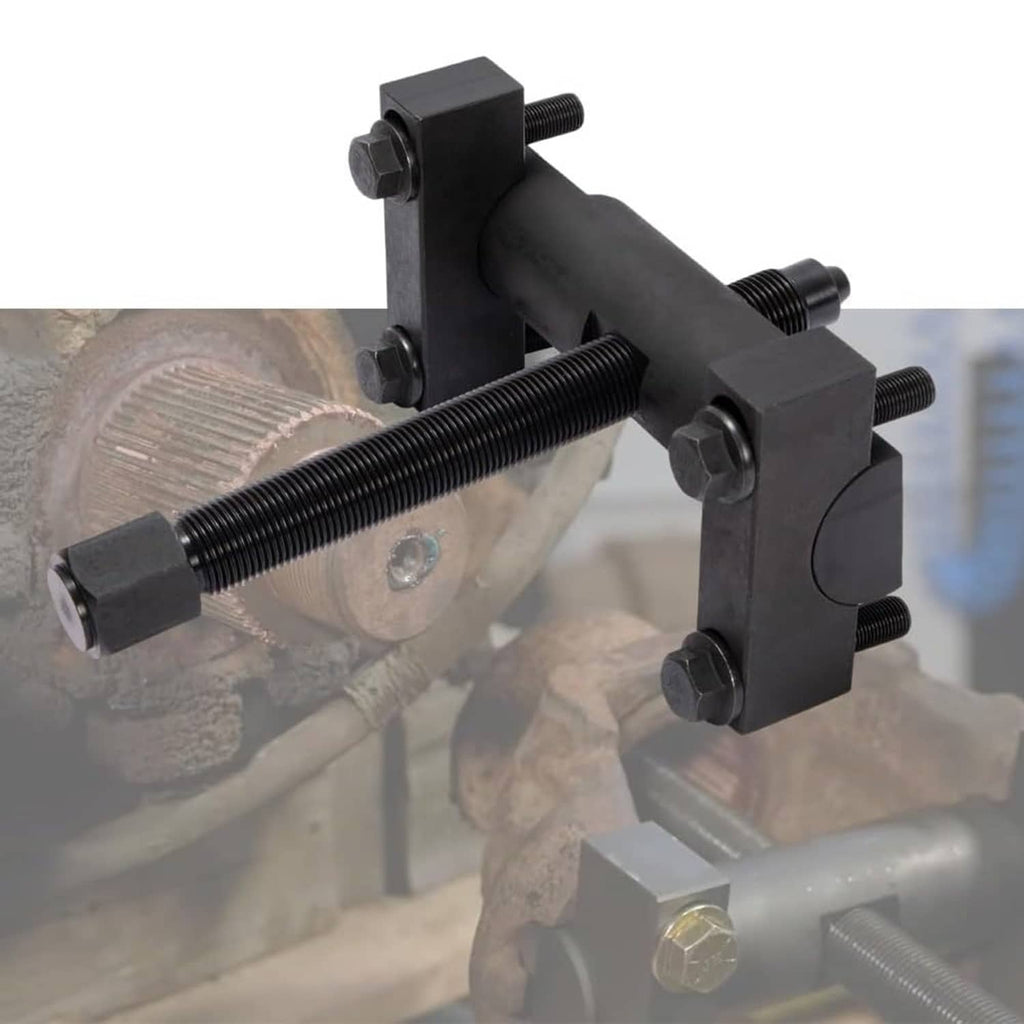 Yoke puller tool clamped to axle hub with long screw pressing against bearing