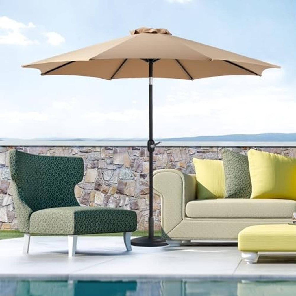Tan patio umbrella over outdoor seating area