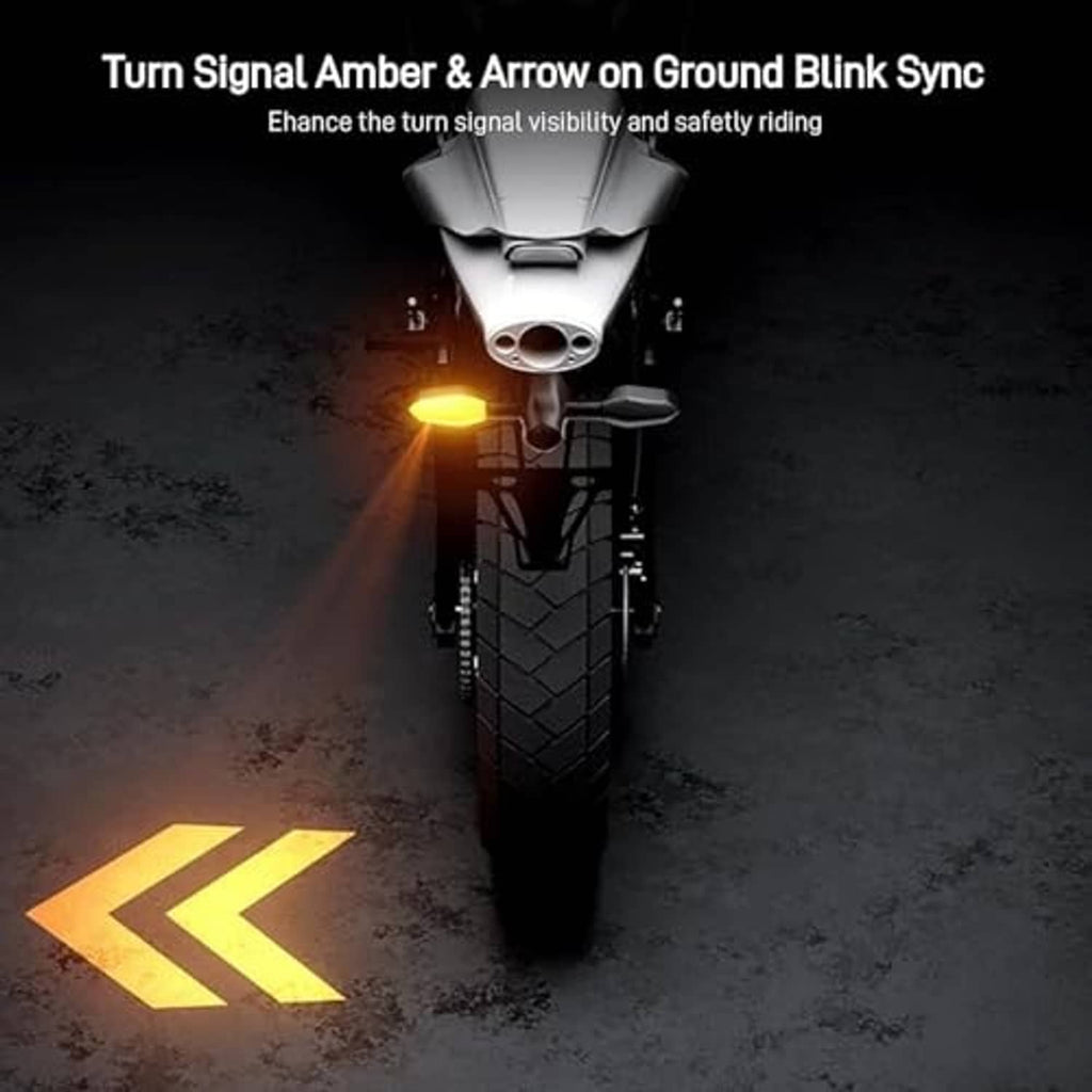 Motorcycle turn signal projector displaying an amber arrow on the ground
