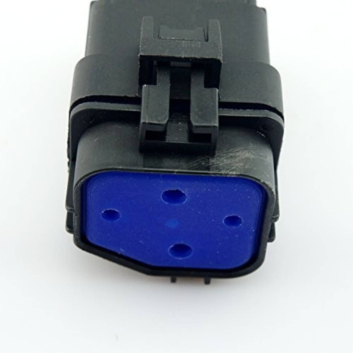 Close-up of 4-pin waterproof car relay blue contact insert inside black housing
