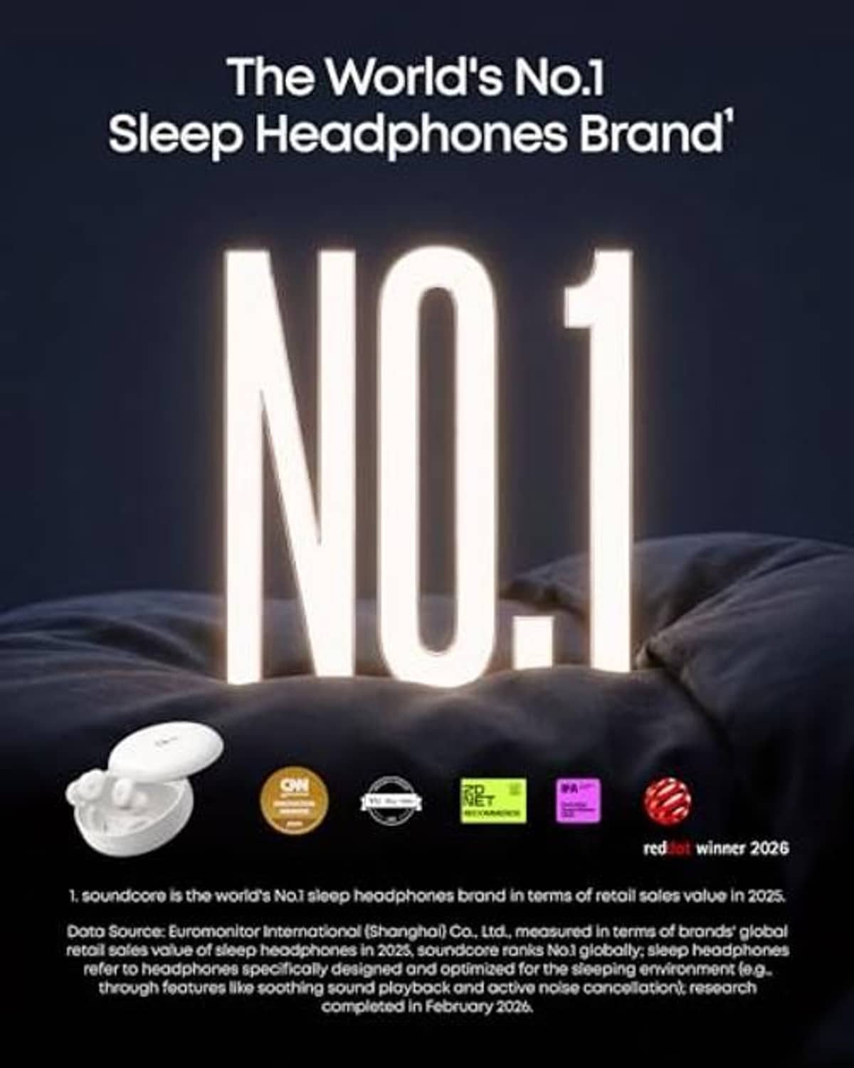 White sleep earbuds resting on a dark surface with charging case nearby