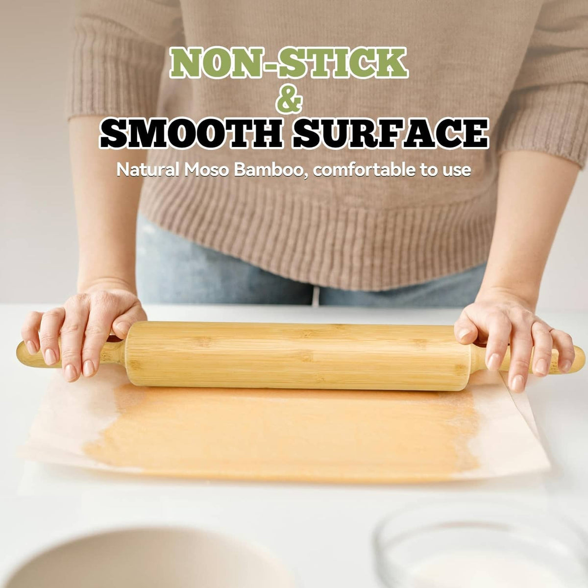 Bamboo rolling pin held by hands over rolled dough sheet
