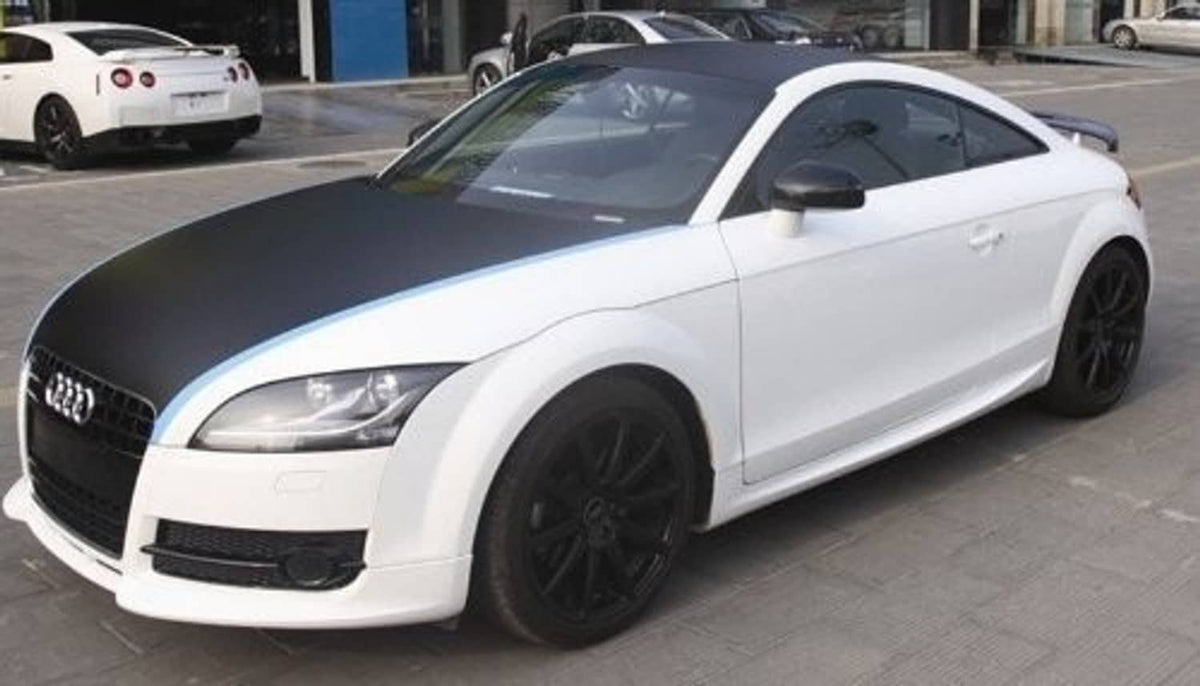 Car hood and side trim wrapped in black carbon fiber twill film with glossy weave