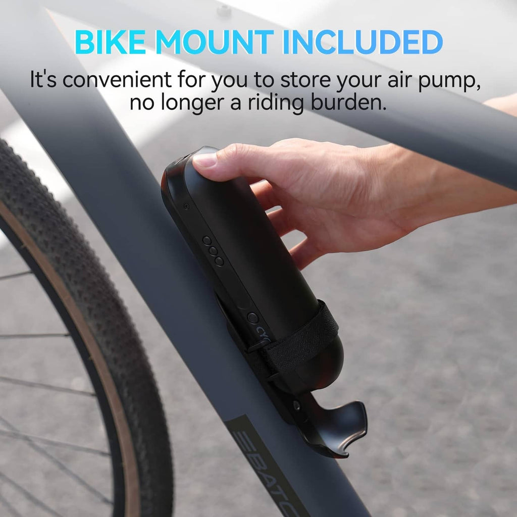 Black electric air pump secured in bike mount holder with hand holding it