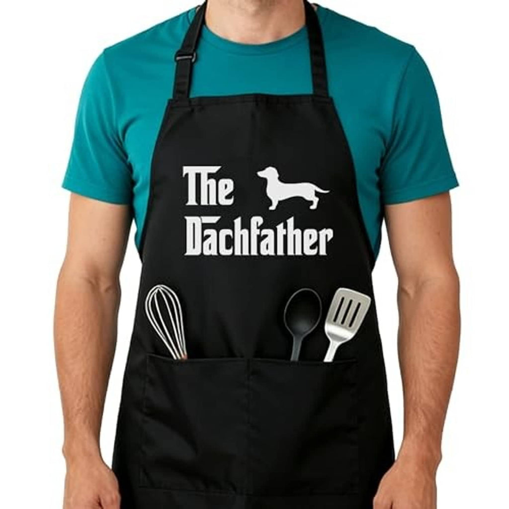Black adjustable kitchen apron with Dachfather dog graphic and utensil pocket print.