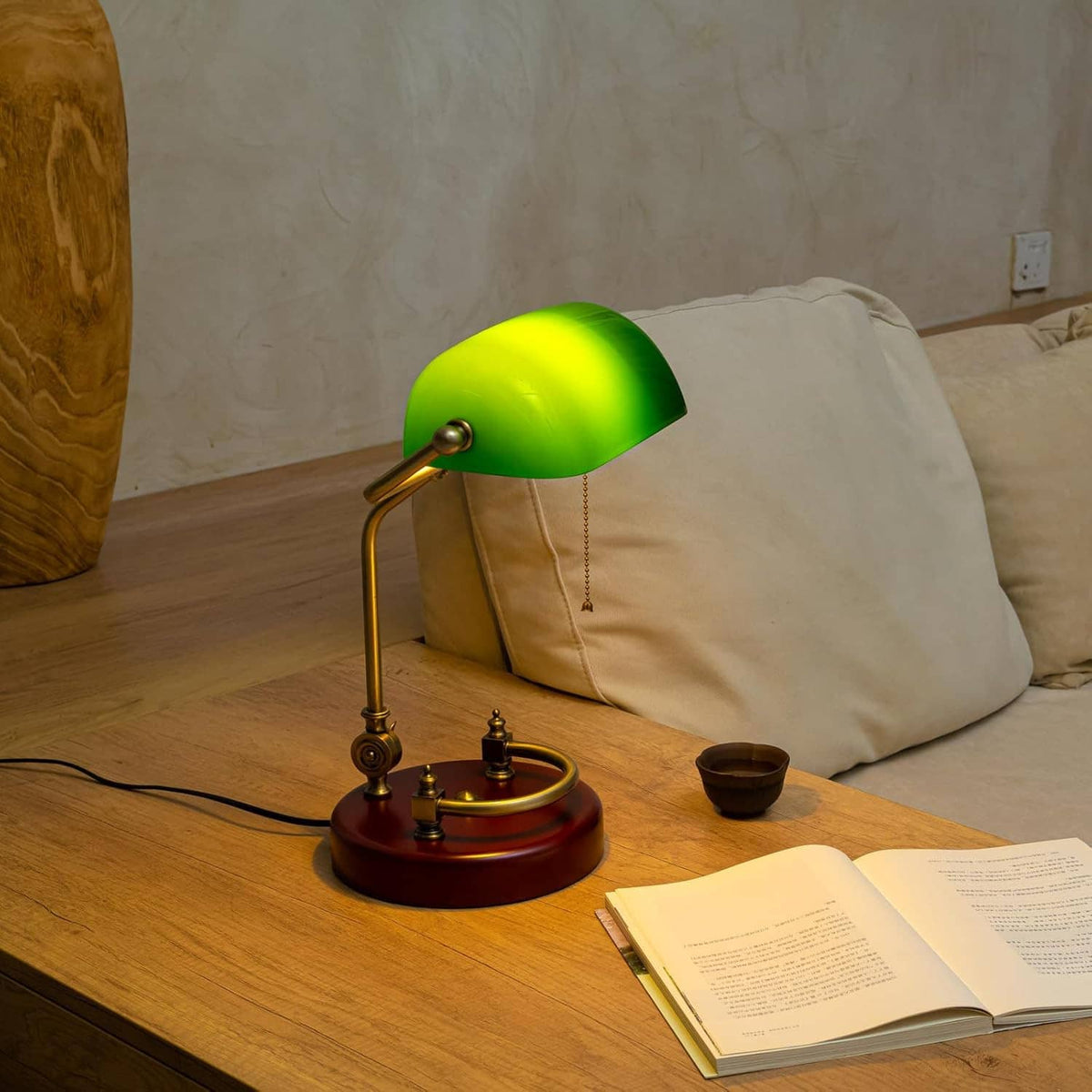 Green glass bankers desk lamp with brass stem and round red wood base
