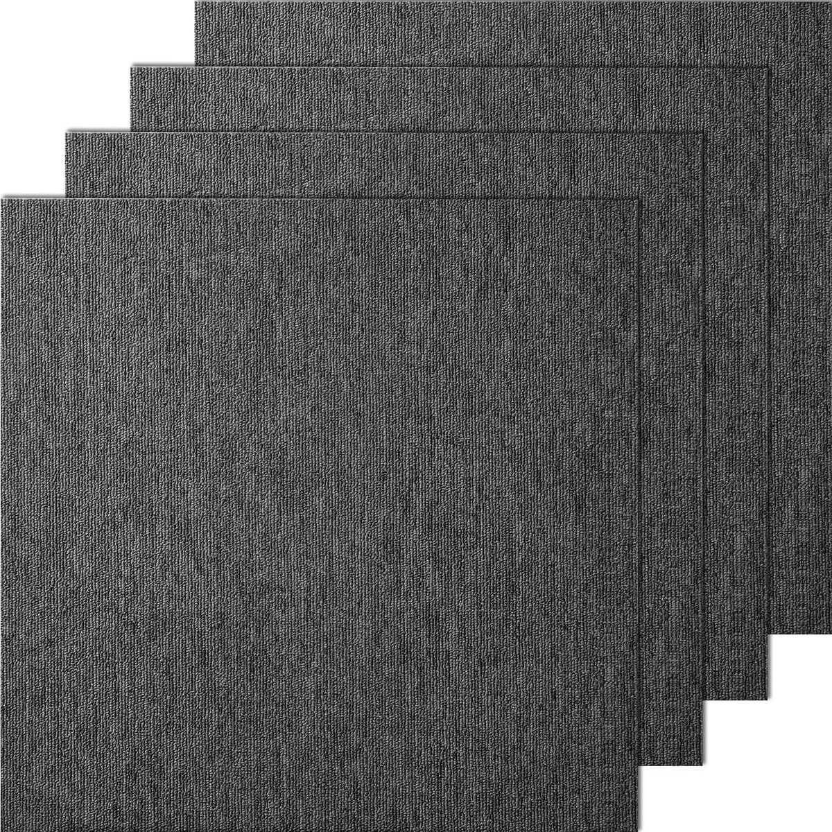 Dark gray carpet tile squares with attached padding, stacked for a layered view