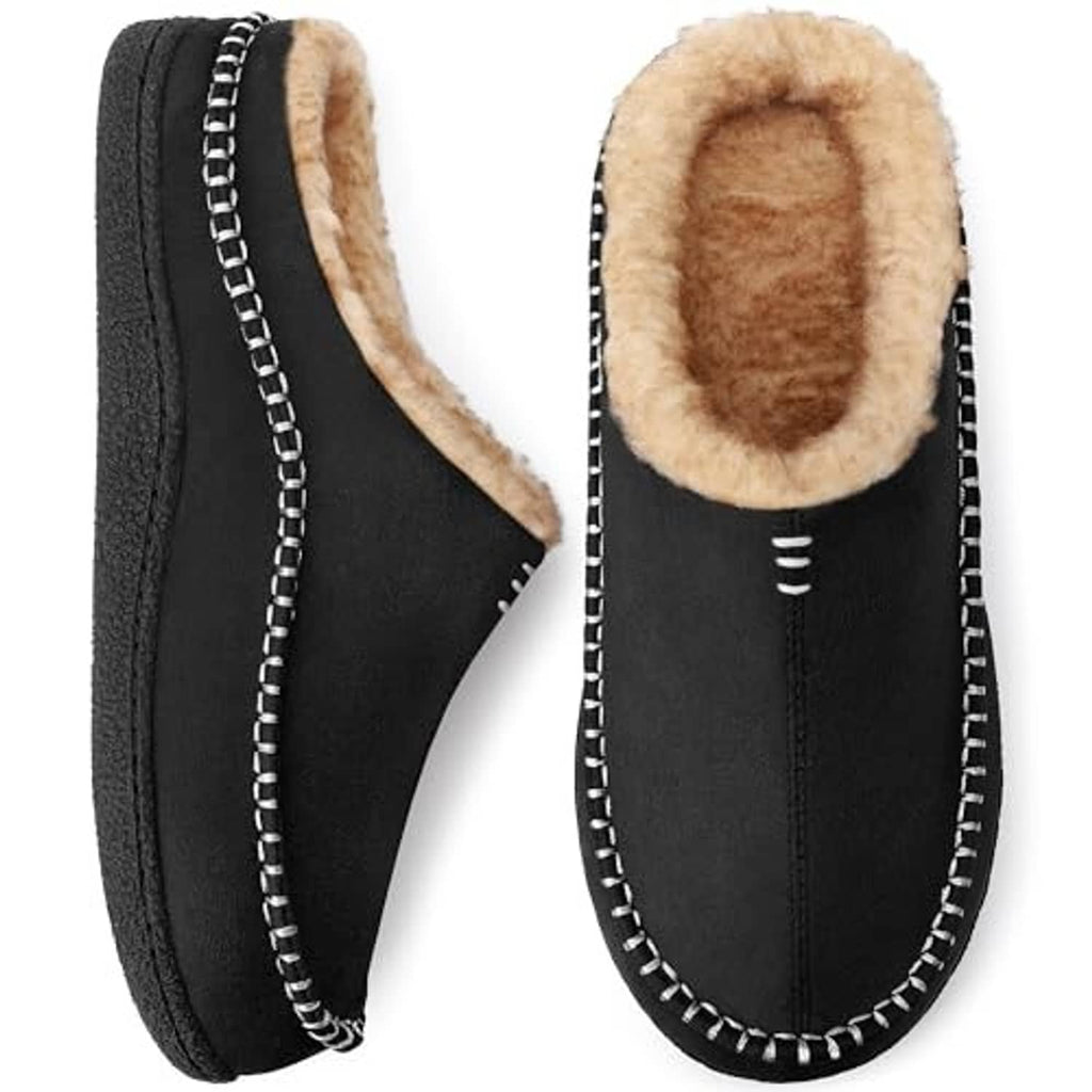 Black slip-on house slippers with tan interior lining and decorative white-edge stitching.