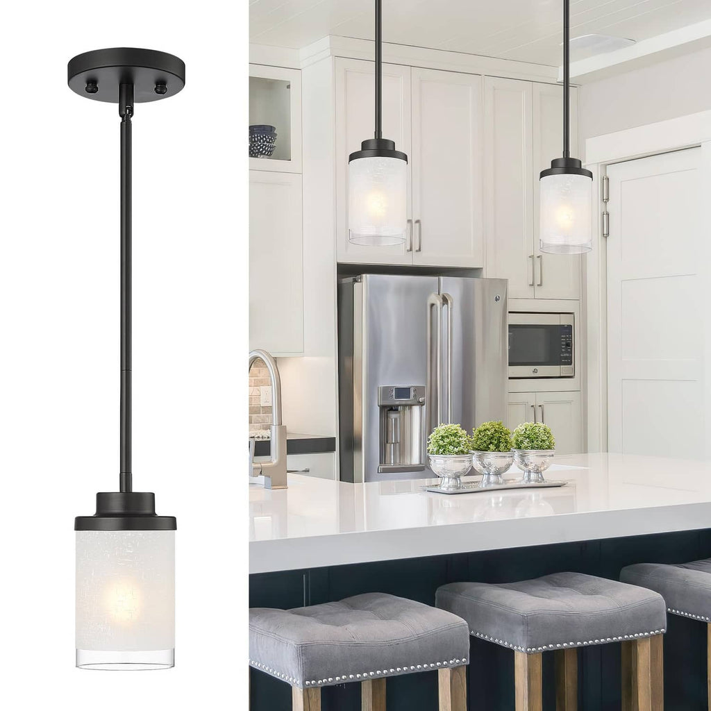Matte black pendant light with frosted glass cylinder shade and round ceiling canopy.