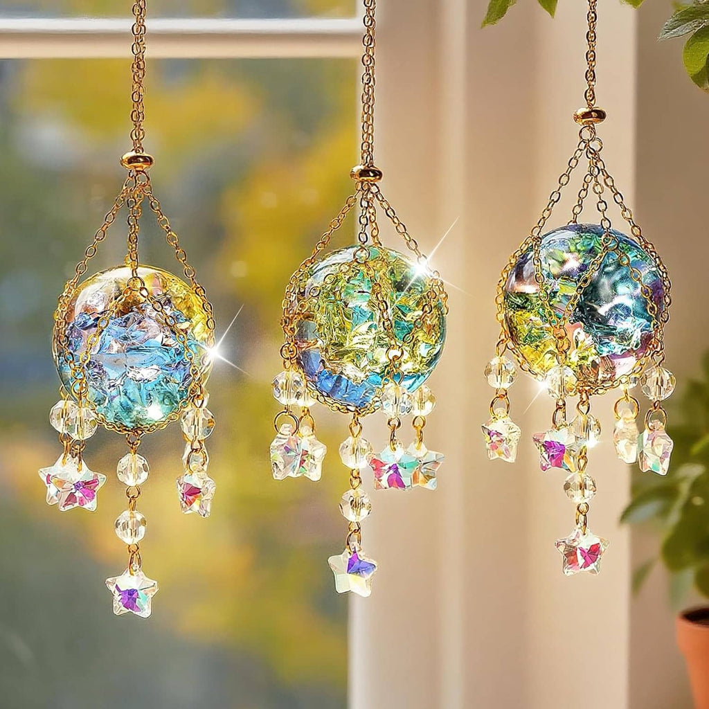 Three gold hanging crystal suncatchers with faceted clear balls and star charms