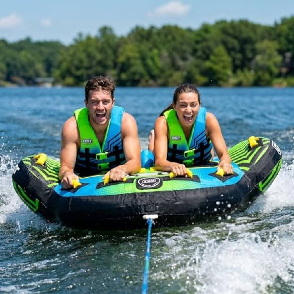 Two-person towable tube in blue and green with wing fins and riders seated