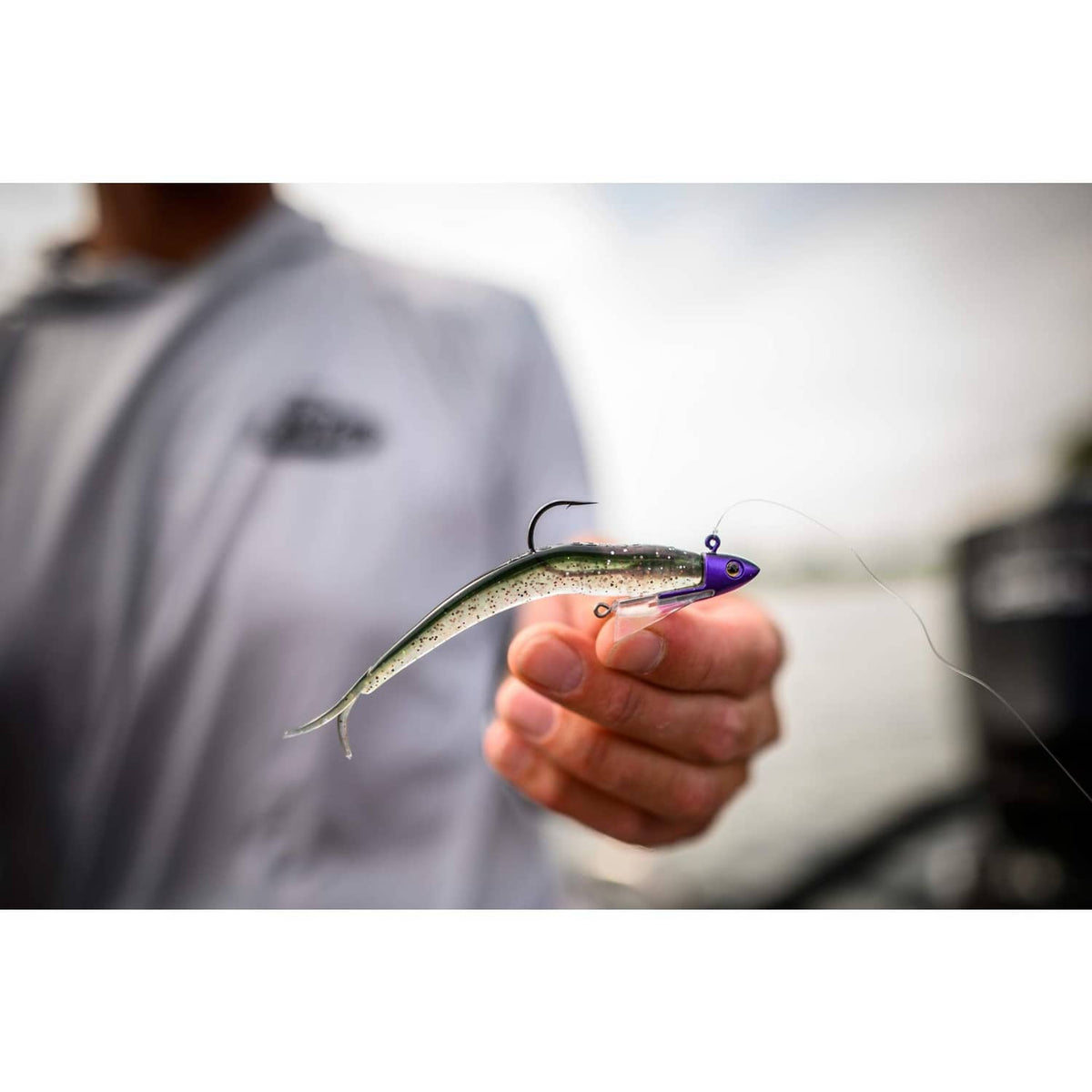Green shiner-style swimbait with purple head and visible hook