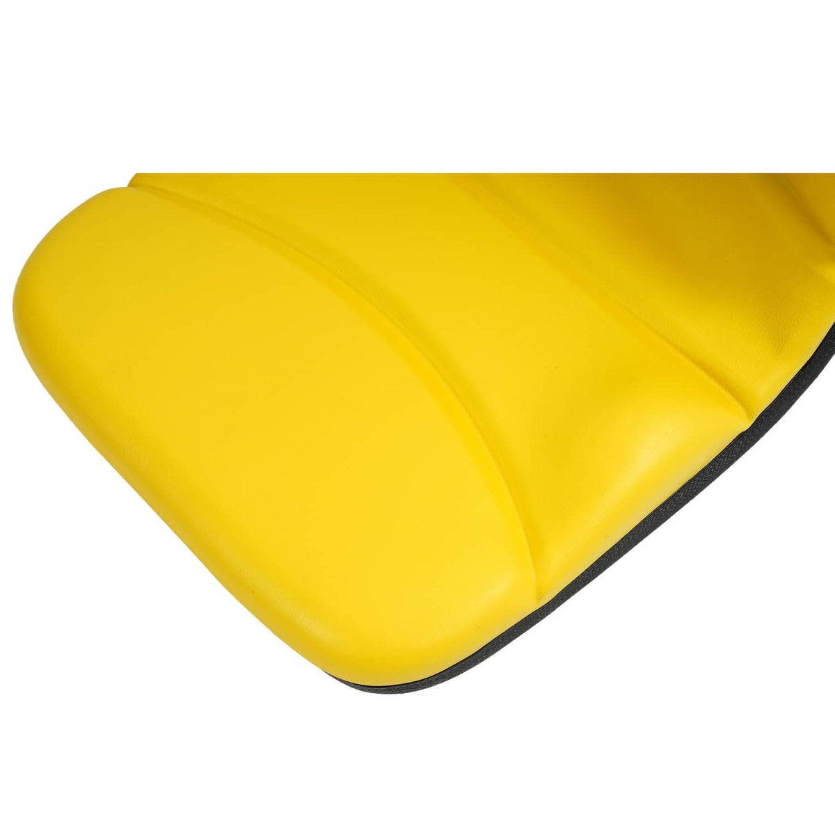 Yellow tractor seat cushion corner with smooth vinyl surface and edge seam