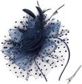 Navy polka-dot tulle fascinator hat with flower, pearls, and feather accents