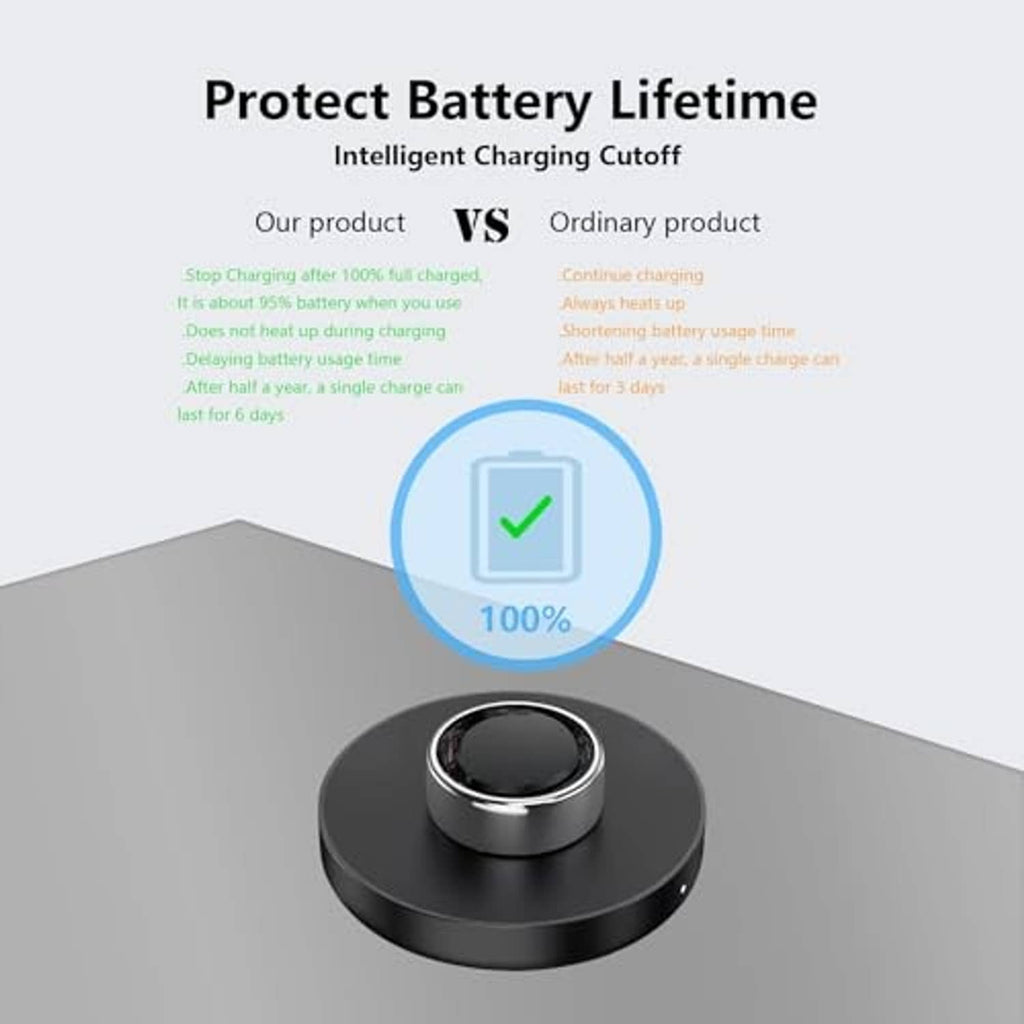 Black charging dock with central cup for a ring, shown on a tabletop