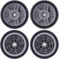Set of four lawn mower drive wheels with gray hubs and black rubber tires