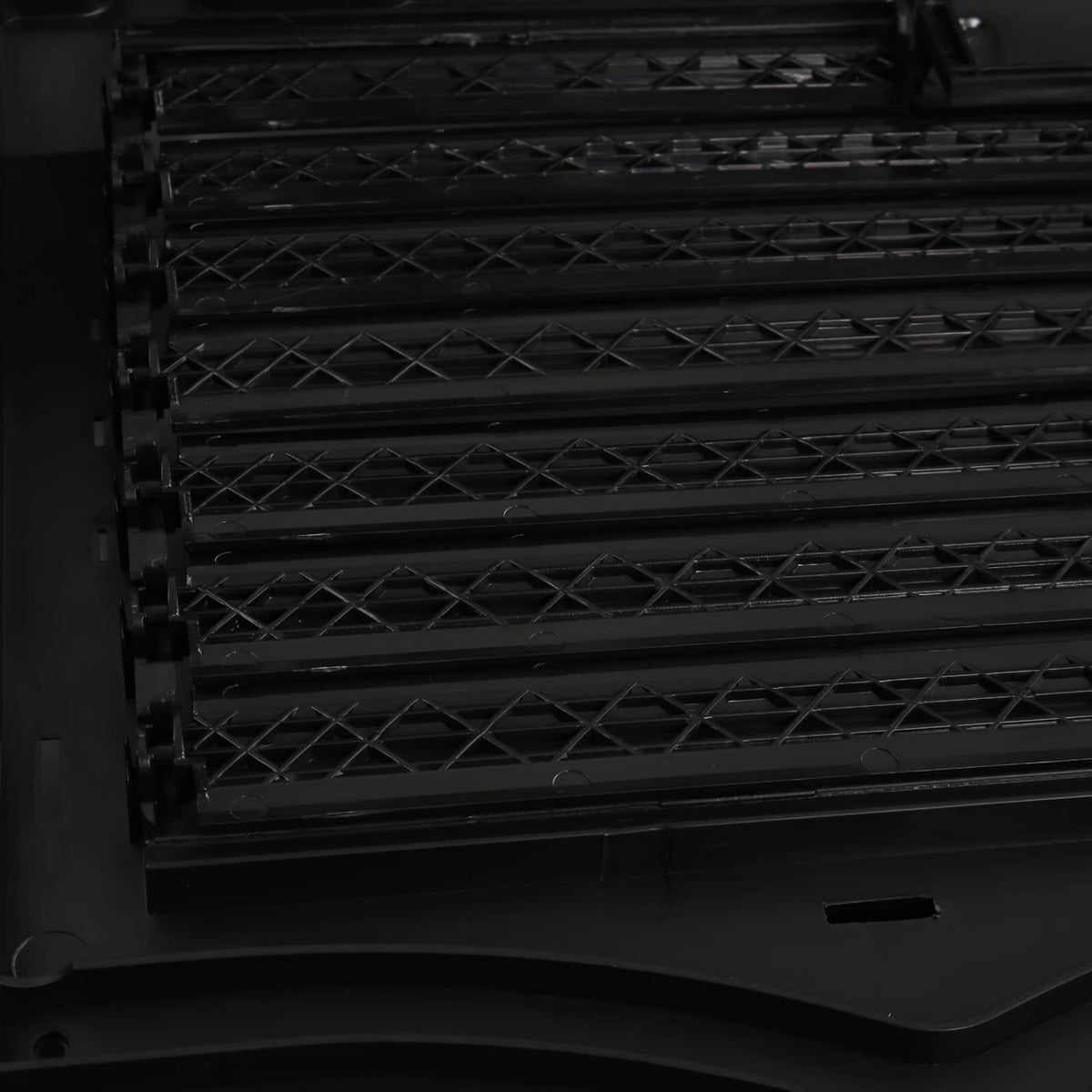 Black grille shutter slats inside the shutter housing