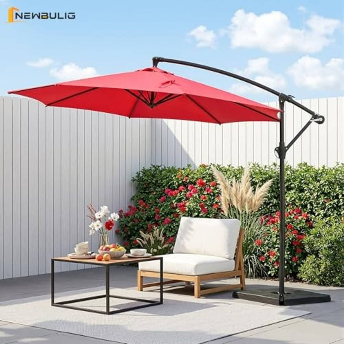 Bright red offset patio umbrella with black curved arm, open canopy, and weighted base