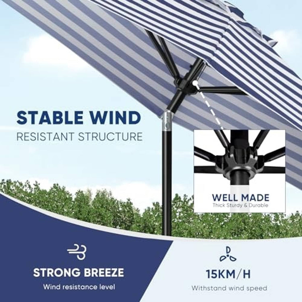 Blue-and-white striped beach umbrella close-up of tilt crank and support pole