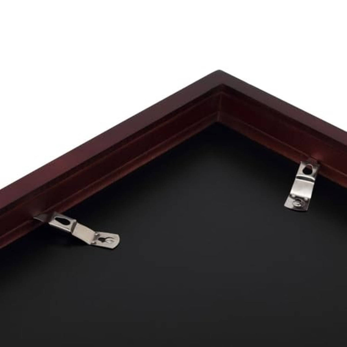 Interior corner of dark wood deep picture frame with metal mounting clips
