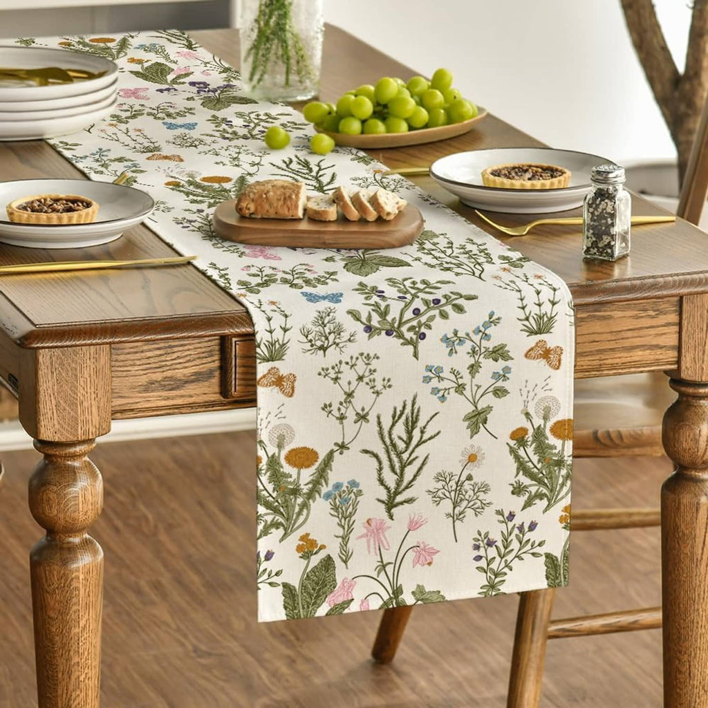 Floral table runner with botanical pattern and pastel flowers, centered on table