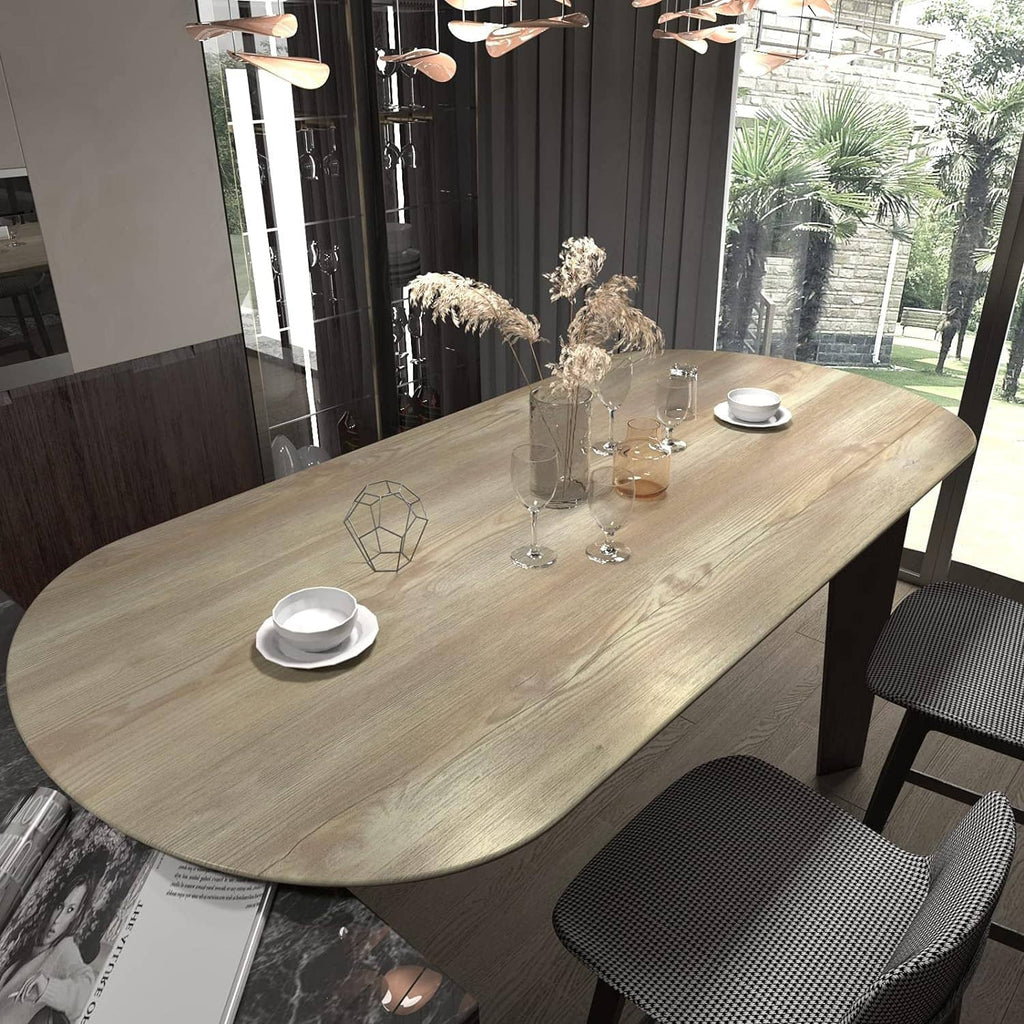 Wood-grain peel-and-stick paper on oval dining table, light beige with subtle knots
