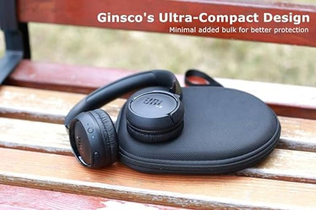 Black slim headphone case on a wooden surface with over-ear headphones inside