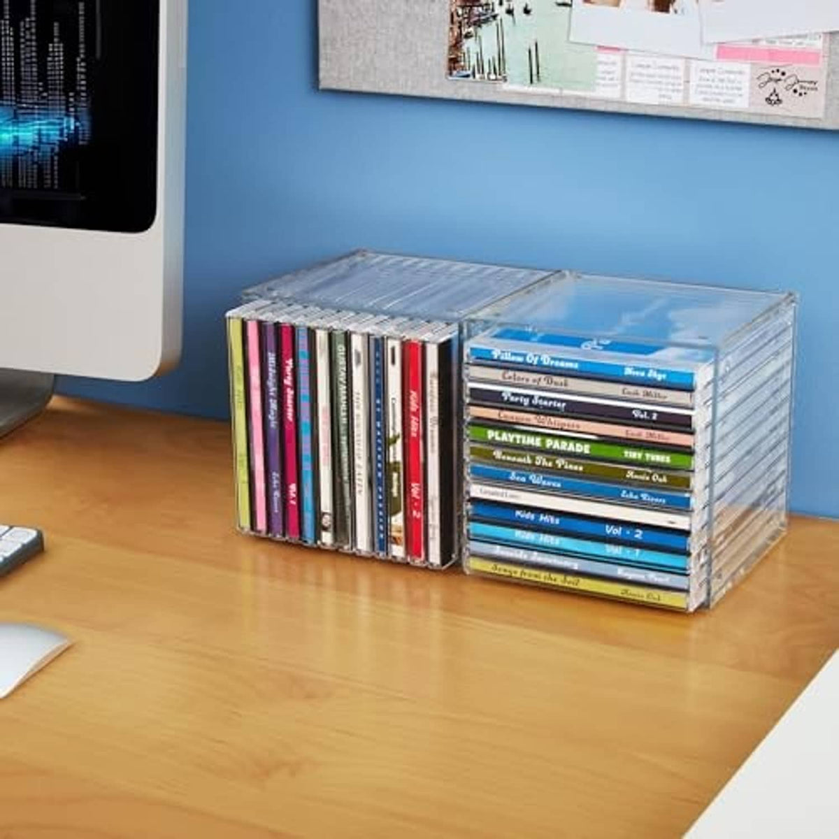 Clear plastic cube CD organizer side view with stacked jewel case storage.