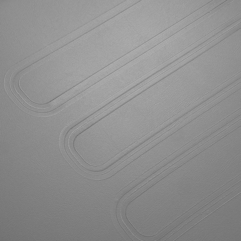 Close-up of gray textured cushion surface with molded lines