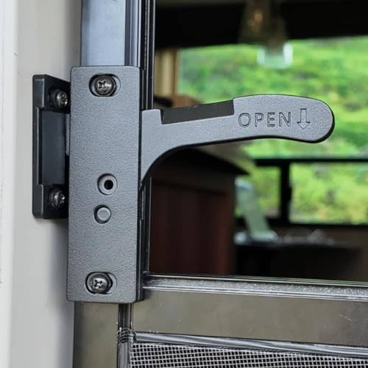 Gray metal RV screen door latch handle with OPEN lever and mounting screws