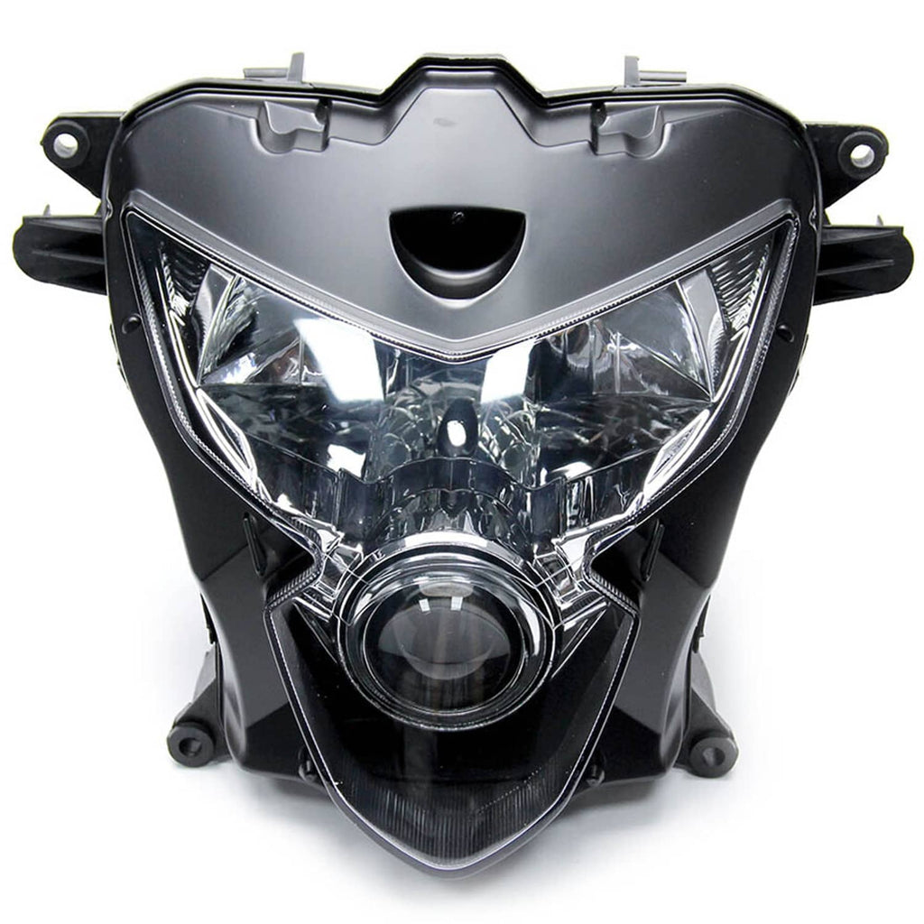 Motorcycle headlight assembly close-up, black housing with clear projector lens