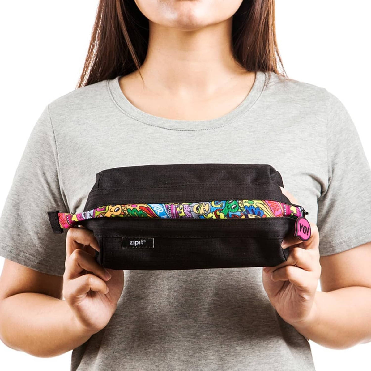 Black ZIPIT pencil case held up with colorful doodle zipper strap and zip pull charm