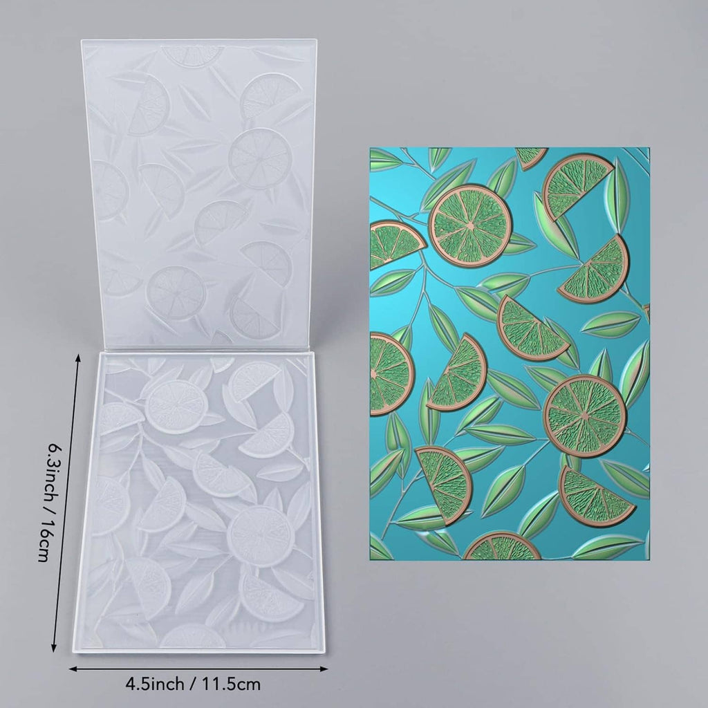 Open 3D embossing folder showing raised lemon and citrus shapes, 4.5 x 3.0 in