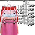 Silver clip pants hanger set holding folded skirts and pants on multiple bars